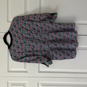 Anthropology top sleeves can be worn full length or button down to 3/4 length